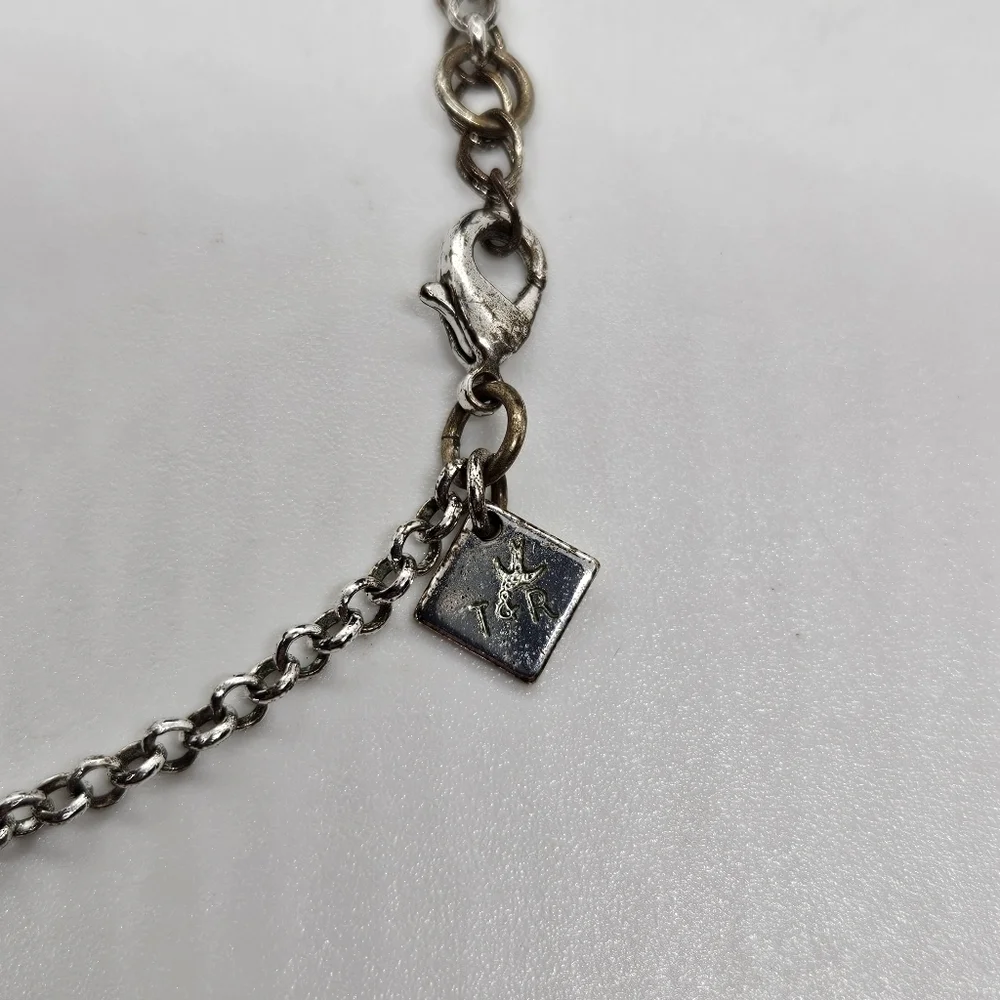 T&R silver tone leaf bib necklace